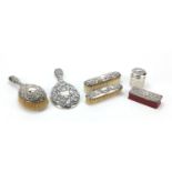 Six Victorian and later silver dressing table items including a hand mirror by Goldsmith and