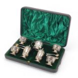 George V seven piece silver cruet set by Walker & Hall Birmingham 1918, housed in a velvet and