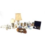 Miscellaneous items including commemorative coins, beersteins, continental figures, table lamps