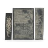 Three Chinese ink stones including one carved with two young girls in a palace, the largest 11.5cm x