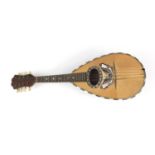 Italian melon shaped mandolin inlaid with a butterfly, bearing a Stridente label, 60cm in length :