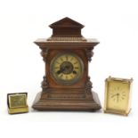 Victorian walnut striking mantel clock, Europa travel clock and a brass cased carriage clock, the