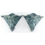 Pair of blue glazed rams head design pottery wall pockets of triangular form, 26cm H x 31cm W :For