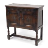 Carved oak side cabinet fitted with a pair of cupboard doors, 76cm H x 75cm W x 32cm D :For