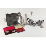 Silver plate including gallery tray with paw feet, three piece tea service, three branch