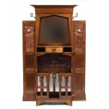 Arts & Crafts oak hall stand with bevelled mirror and copper inserts to each wing, remnants of the