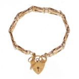 9ct gold four row gate bracelet with love heart shaped padlock, 10.0g :For Further Condition Reports