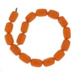 Amber coloured bead necklace, each bead 2.5cm in length, overall 40cm in length, 74.0g :For