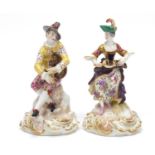 Pair of Meissen style porcelain figures, cross sword marks to the bases, each 14cm high :For Further