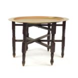 Mahogany and brass folding tray top table, 44cm high x 65cm in diameter :For Further Condition