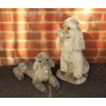 Two stoneware garden statues of dogs, the largest 48cm high :For Further Condition Reports Please