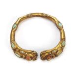 Tibetan gilt metal mythical animal bangle set with turquoise and coral, 8cm wide :For Further