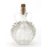 Antique glass bottle with twin handles etched with windmills, boats and grapes, 21.5cm high :For