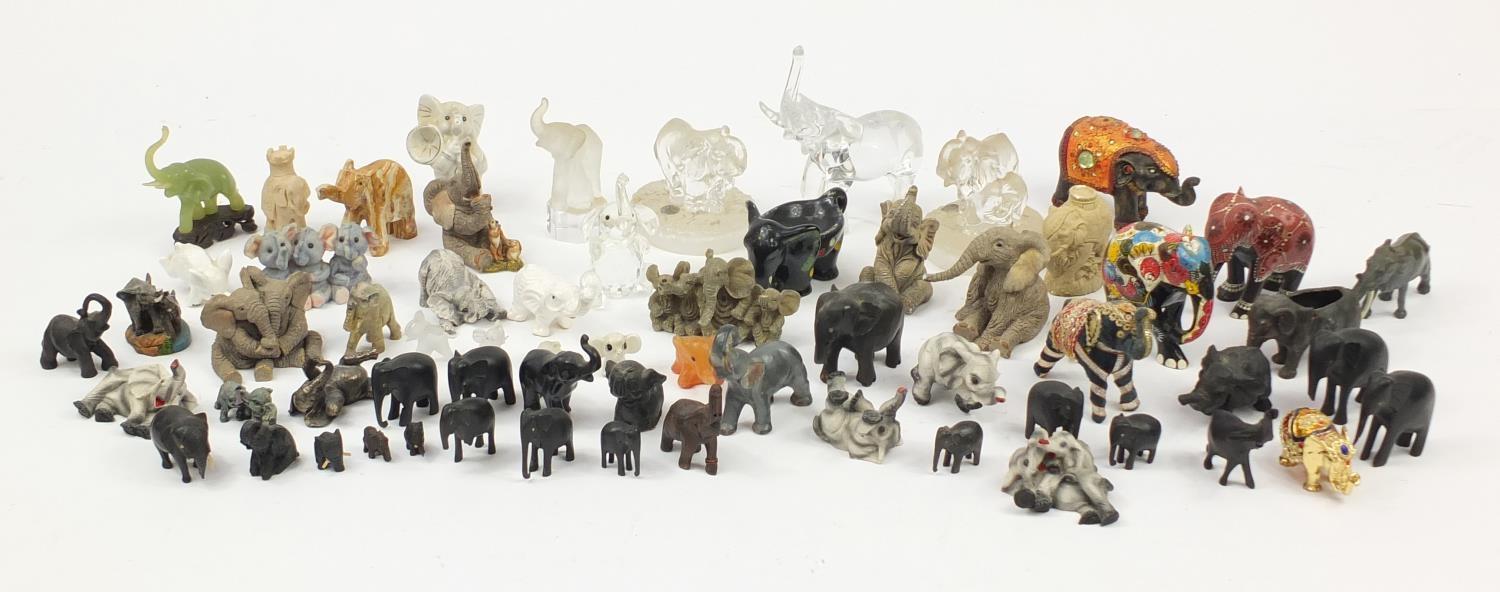 Large collection of model elephants including glass, ceramic, pottery and wooden examples, the