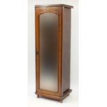 Walnut single wardrobe with mirrored door enclosing four pull out shelves above three drawers, 195cm