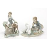 Two Lladro figure groups including one of a young girl with a calf, the largest 21.5cm high :For