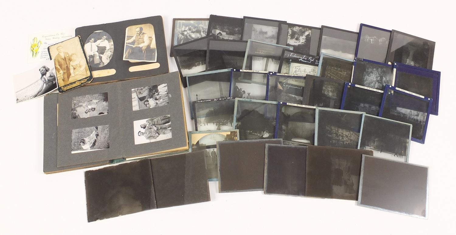 Vintage glass slide and black and white photographs arranged in two albums :For Further Condition