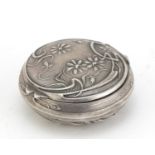 Art Nouveau unmarked silver compact embossed with stylised flowers, 4.8cm in diameter, 17.5g :For