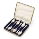 Set of six golfing interest silver teaspoons by Walker & Hall, housed in a fitted case, Sheffield