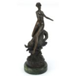 Large patinated bronze study of a nude Art Deco female upon a dolphin, raised on a circular green