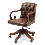 Mahogany framed captains chair with brown leather button back upholstery :For Further Condition