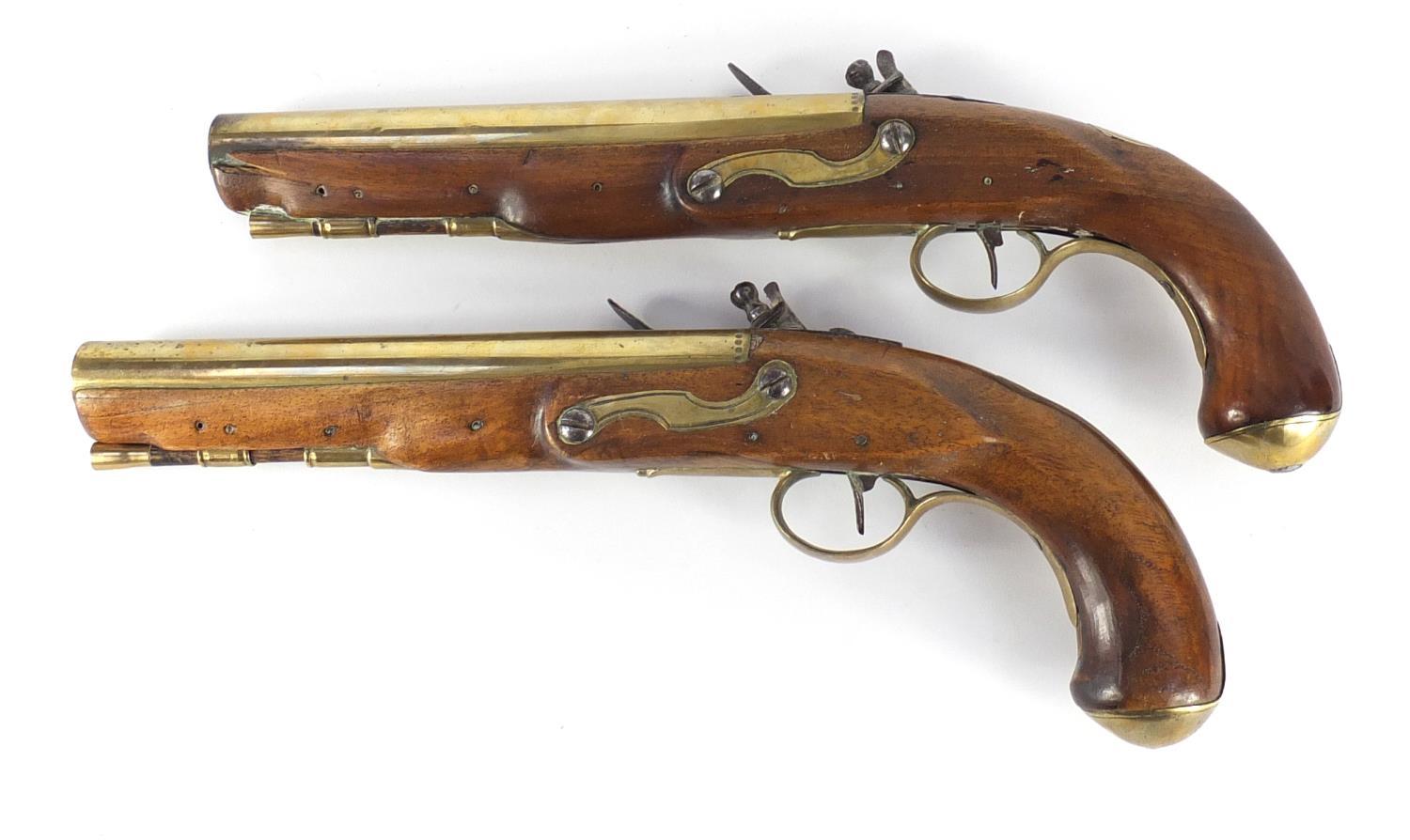 Pair of George III walnut flintlock holster pistols by Thomas Ketland & Co, the brass barrels - Image 7 of 13