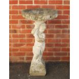 Stoneware garden birdbath in the form of a young figure holding a cornucopia, 90cm high :For Further