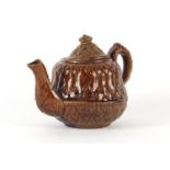19th century treacle glazed pottery teapot with corn design , 11cm high :For Further Condition