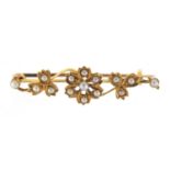 15ct gold seed pearl floral brooch, housed in a H Richardson tooled leather box, 4.5cm in length,