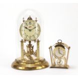 Two Schatz clocks including an anniversary example with glass dome, the largest 30cm high :For