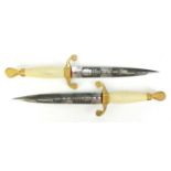 Pair of Wilkinson presentation daggers given as darts prizes, each with ornate steel blades, each