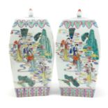 Pair of Chinese porcelain jars and covers, each hand painted in the famille rose palette with