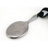 Silver pendant in the form of a hand mirror, indistinct maker's mark, Birmingham 1946, 7.5cm in