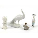 Four collectable figures comprising Royal Dux peacock, Bing & Grondahl Boy and Chick, Hollow Haza of