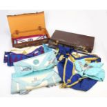 Masonic regalia including aprons and jewels housed in two brown leather cases :For Further Condition