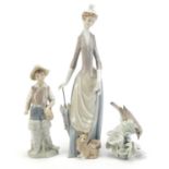 Lladro including large figurine with a Corgi and a figure of a young boy, the largest 37cm high :For