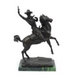 Large patinated bronze sculpture of a cowboy on horseback, raised on a rectangular green