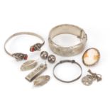 Mostly silver jewellery including Victorian and later bangles, a cameo brooch and ingot pendant,
