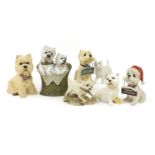 Seven Westie dog models including a stick stand, the largest 36.5cm high :For Further Condition