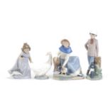 Four Nao figures and animals including one of a lady with her cat, the largest 24cm high :For