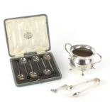 Silver items comprising twin handled sugar bowl, set of six coffee bean spoons in a fitted case,