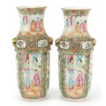 Pair of Chinese Canton porcelain vases with twin handles, each hand painted in the famille rose