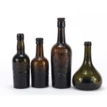 Four antique glass bottles including Fremlin & Wynand Fockink the largest 26cm high :For Further