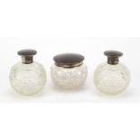 Pair of globular cut glass scent bottles with silver & tortoise shell hinged lids and a matching