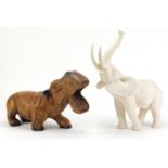 Carved wood hippopotamus and a large elephant, the largest 41cm high :For Further Condition