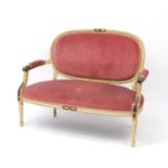 French style cream and gilt two-seater salon settee with pink upholstery, 120cm in length :For