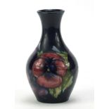 Moorcroft pottery vase, hand painted with flowers, painted and impressed marks to the base, 14.5cm