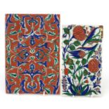 Two Iznik pottery tile fragments hand painted with flowers, the largest 24cm x 16.5cm :For Further