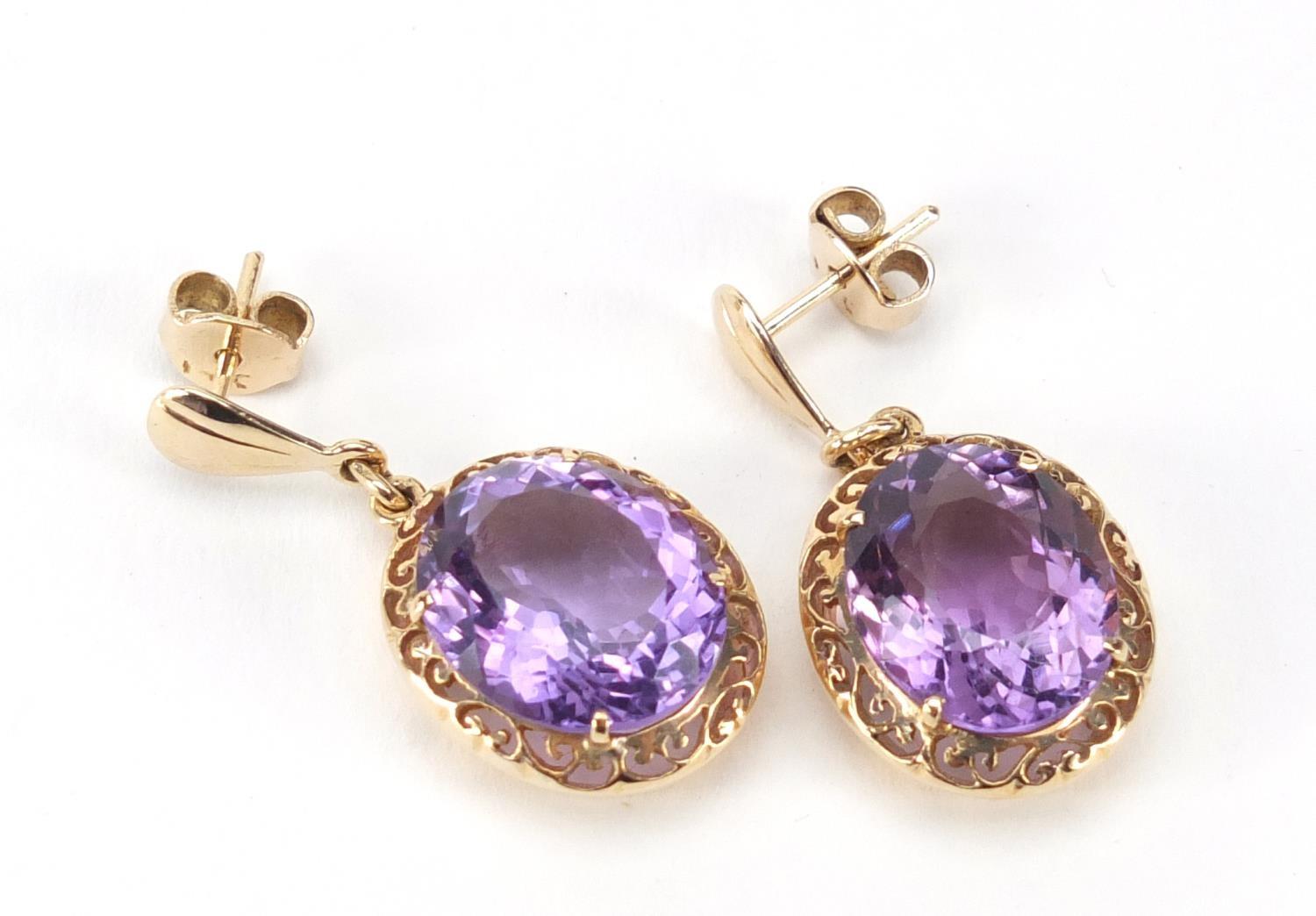 Pair of unmarked gold amethyst earrings, 3.2cm in length, 8.4g :For Further Condition Reports Please