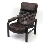 Mid-century Danish easy chair by Oy Bj Dahlqvist Ab, with ebonised frame and brown leather button